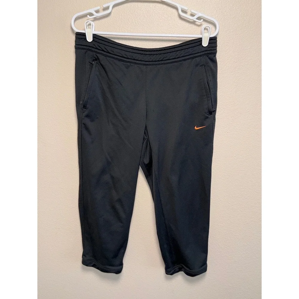 Nike Dri-FIT Women Black Cropped Athletic Joggers Zipper Pockets Orange Swoosh L